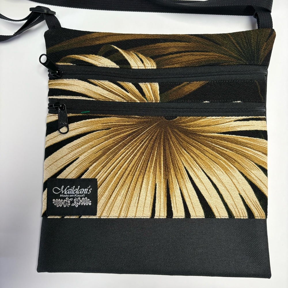 Mailelani’s Kahala Elite Travel Bag Black and Gold Crossbody Bag